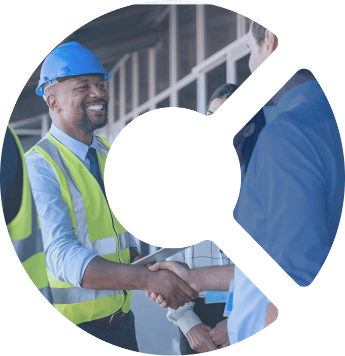 Construction worker and manager shaking hands